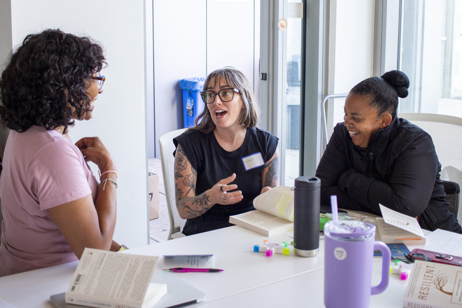 Workshop attendees meet in small groups to discuss a recent presentation.