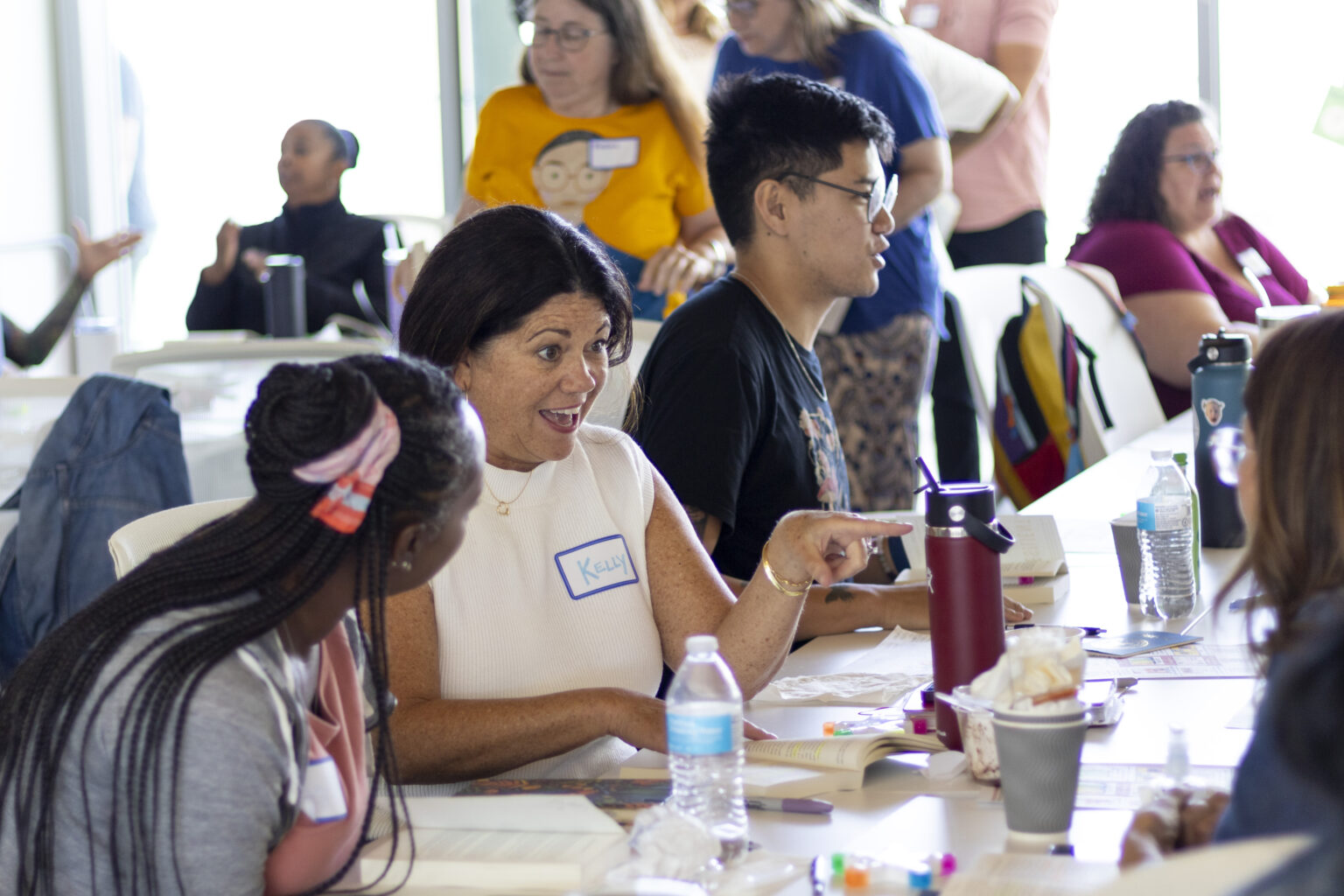 Workshop attendees smile and laugh during a presentation at a CRLP event.